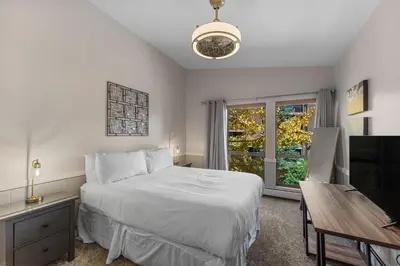 a bedroom with a bed and a desk and a television at Lake Cliffe 305 Building A in Dillon