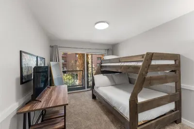 a bedroom with a bunk bed and a desk at Lake Cliffe 305 Building A in Dillon