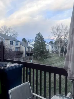 a balcony with a view of a yard and houses at Cozy Room with Private Entrance and Patio near Denver in Westminster