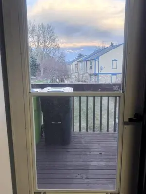 a view of a deck from a door with a window at Cozy Room with Private Entrance and Patio near Denver in Westminster