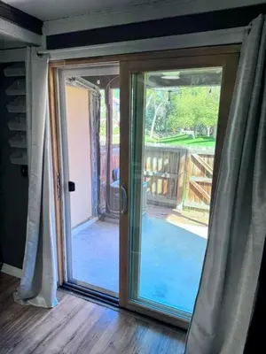a sliding glass door with a view of a porch at Cozy Room with Private Entrance and Patio near Denver in Westminster