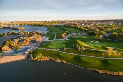 an aerial view of a golf course next to the water at Windshire Retreat with Pool, Garage and Pet-Friendly in Windsor