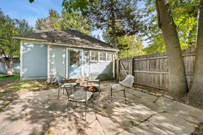 a group of chairs and a table in front of a house at Oak Street Bungalow Walk to Old Town and CSU in Fort Collins
