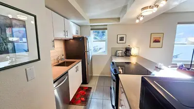 a kitchen with a sink and a stove top oven at Mountain Side D277 in Frisco