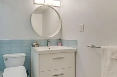 a bathroom with a white sink and a mirror at Mountain Side D277 in Frisco