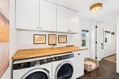 a laundry room with a washer and dryer at Sunset Haven Dog-friendly Home Near Trails and Lake in Fort Collins