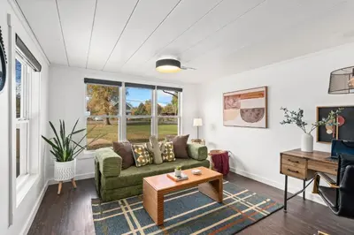 a living room with a couch and a table at Sunset Haven Dog-friendly Home Near Trails and Lake in Fort Collins