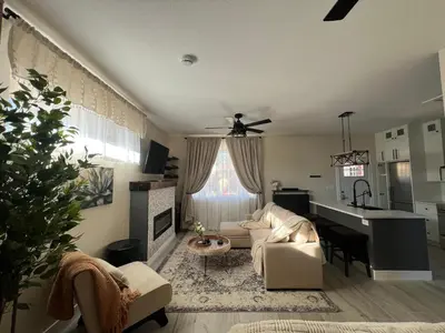 a living room with a couch and a table at Su Casa Studio in Denver