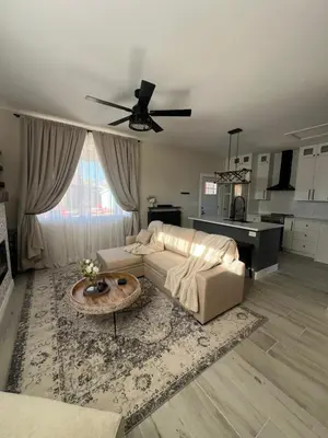 a living room with a couch and a table at Su Casa Studio in Denver