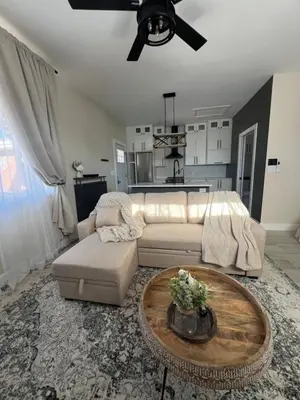 a living room with a couch and a table at Su Casa Studio in Denver