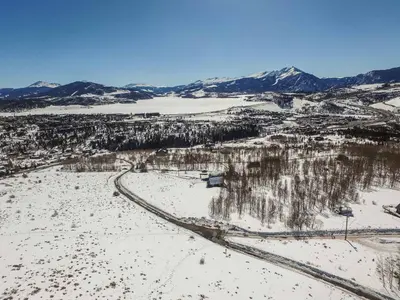 an aerial view of a snow covered valley with mountains at 10-Person HotTub, ViewHouse, Steps to Trail, Close to Ski Resorts, FirePit in Silverthorne