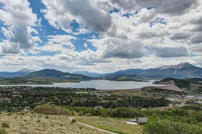 a view of a town and a lake with mountains at 10-Person HotTub, ViewHouse, Steps to Trail, Close to Ski Resorts, FirePit in Silverthorne