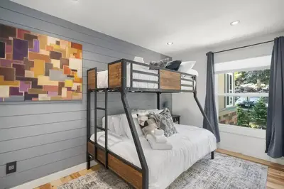a bedroom with a bunk bed and a large window at Blue Bear - Perfect Mountain Getaway in Idaho Springs