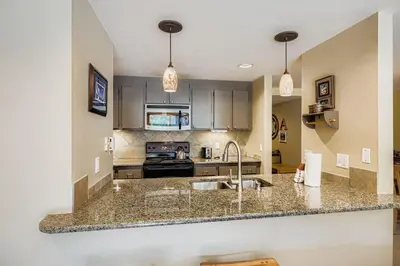 a kitchen with a sink and a counter top at 1806 Decatur condo in Keystone
