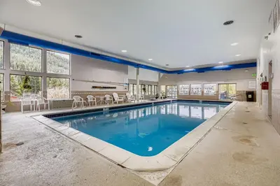 a large swimming pool in a large room with at 1806 Decatur condo in Keystone