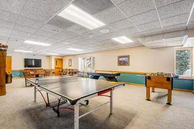 a ping pong room with a ping pong table at Iron Horse Resort 5064 in Winter Park