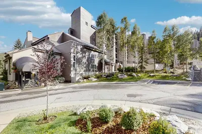 a house with a tree in the middle of a street at Iron Horse Resort 3063 in Winter Park