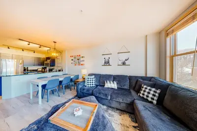 a living room with a couch and a table at Silvermill Lodge 8285 in Keystone