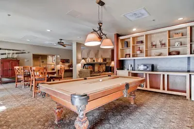 a living room with a pool table in it at Silvermill Lodge 8295 in Keystone