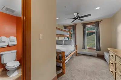 a bedroom with a bed and a toilet and a window at Lone Eagle 3016 in Keystone