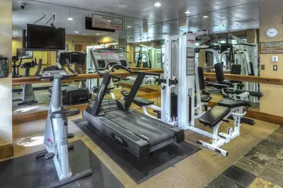 a gym with several tread machines and a treadmill at Lone Eagle 3016 in Keystone