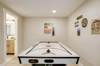 a white room with a table in the corner at Hot Tub and Game Room Peaceful Retreat in Evergreen in Evergreen