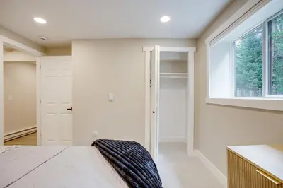 a bedroom with a bed and a window at Hot Tub and Game Room Peaceful Retreat in Evergreen in Evergreen