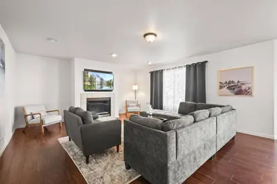 a living room with a couch and two chairs at Spacious SIX Bedroom, Great Location in Longmont