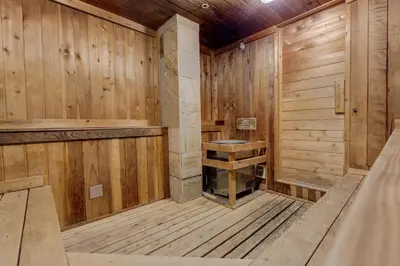 an empty wooden sauna with a bench in it at Brightwood 107 in Keystone