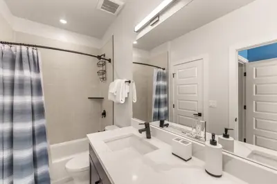 a white bathroom with a sink and a toilet at Brightwood 107 in Keystone