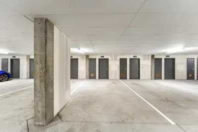 an empty parking garage with a blue car in it at Brightwood 107 in Keystone