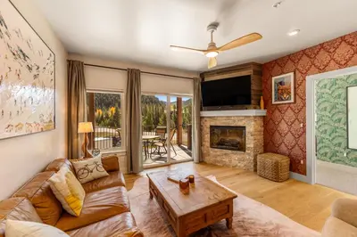 a living room with a couch and a fireplace at Brightwood 107 in Keystone