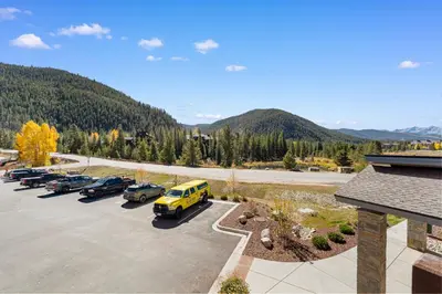 a parking lot with a bunch of cars parked at Brightwood 107 in Keystone