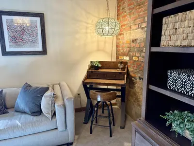 a living room with a piano and a couch at RollinsVilla home in Rollinsville
