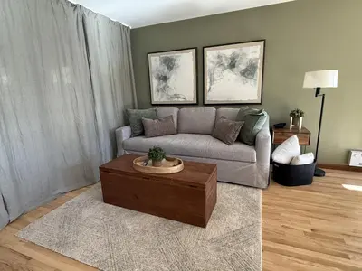 a living room with a couch and a coffee table at RollinsVilla home in Rollinsville