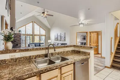 a kitchen with a sink and a counter top at 5094 Gateway condo in Keystone