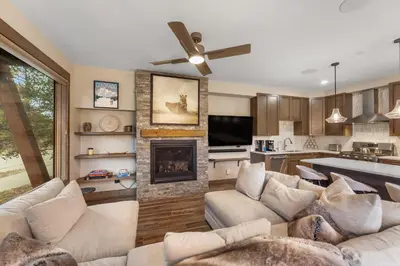 a living room with a couch and a fireplace at Seasons at Keystone 1893 in Keystone