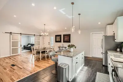 a kitchen and living room with a table and a dining room at Littleton DTC updated GEM with Hot Tub! in Centennial
