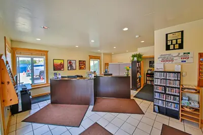 a library with a counter and a book store at Mountainside 049 in Granby