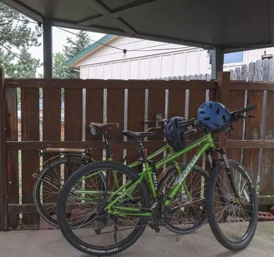 two bikes are parked next to a fence at New cozy Fall foothill retreat in Boulder in Boulder