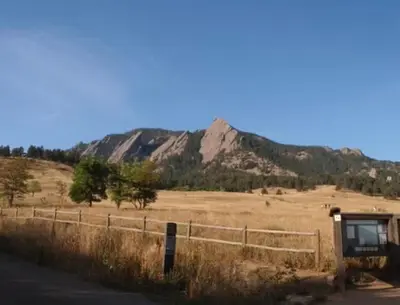a bus stop on the side of a road with a mountain at New cozy Fall foothill retreat in Boulder in Boulder