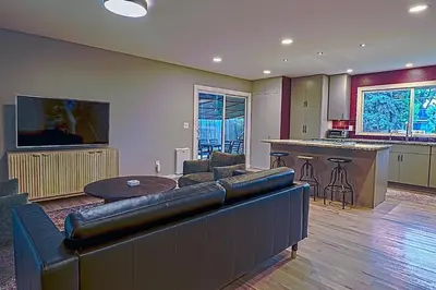 a large living room with a couch and a kitchen at New cozy Fall foothill retreat in Boulder in Boulder