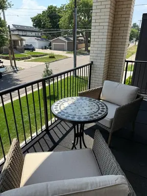 a patio with a table and chairs on a balcony at Cozy 3 Bedroom Denver Home by Mile High Stadium and Downtown! in Denver
