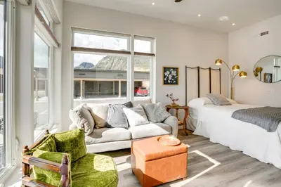 a living room with a bed and a couch at Walk to Ski Shuttles and Stores! Modern Frisco Unit in Frisco