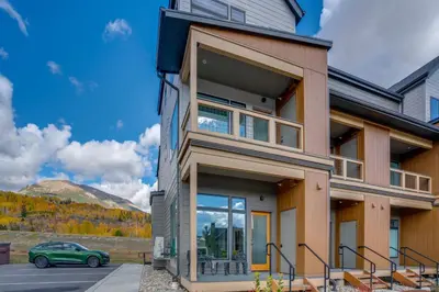 a house with a car parked in front of it at Walk to Ski Shuttles and Stores! Modern Frisco Unit in Frisco