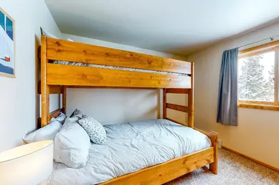 a bedroom with a bunk bed and a window at Timber Ridge 217 in Silverthorne