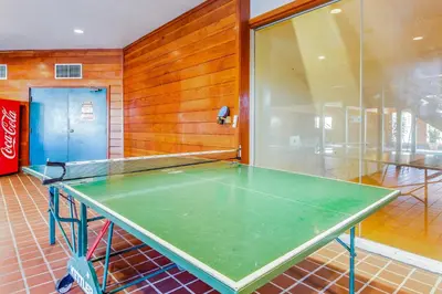 a ping pong table sitting in a room with at Timber Ridge 217 in Silverthorne