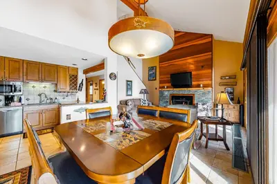 a kitchen and dining room with a table and chairs at Timber Ridge 91226 in Silverthorne