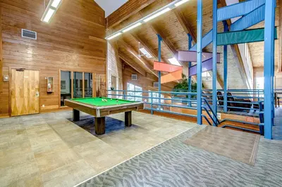 a pool table in a room with wooden walls at Timber Ridge 91226 in Silverthorne