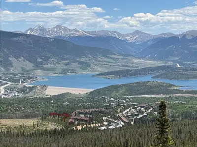 a view of a valley with a lake and mountains at Timber Ridge 91226 in Silverthorne